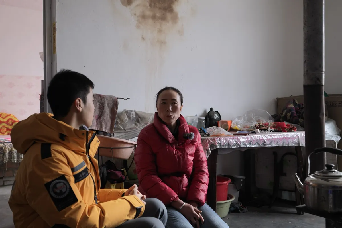 Interviewing a local resident at home in the Tengger Desert